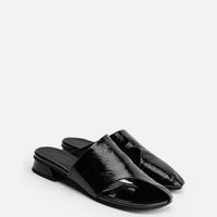 Melanie Black Crinkled Patent Leather Mules - Angled Side View - POEVE Collection