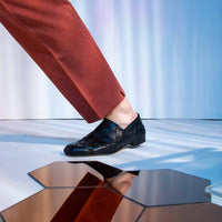 Sand Black Hand-Woven Leather Loafers, styled with rust-coloured trousers - POEVE Collection