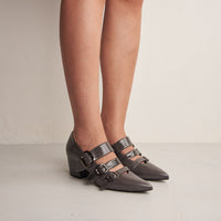 Nova Grey Crinkled Patent Leather Heel Shoes with Metal Buckles, worn on bare legs - POEVE Collection