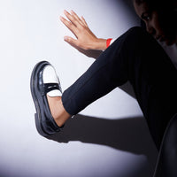 Ollie Black and White Brushed Leather Penny Loafers, styled with black trousers - POEVE Collection