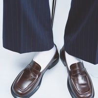 Senna Dark Brown High-Gloss Crinkled Leather Loafers – Campaign Photo – POEVE Collection