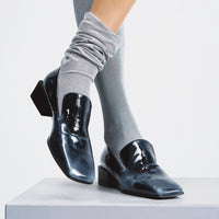 Gwen Pull-Up Black-and-White Leather Loafers – Campaign Photo 2 – POEVE Collection