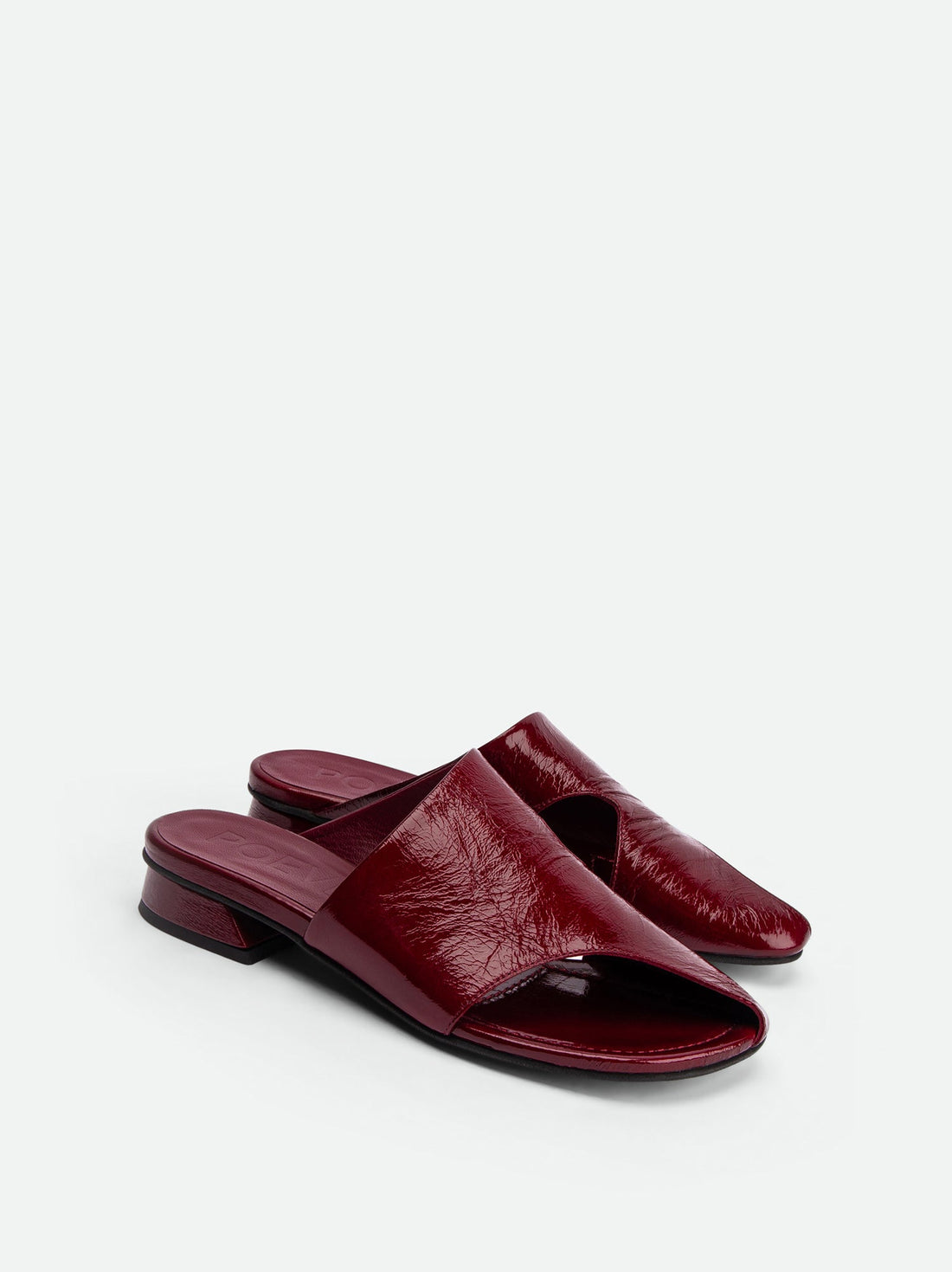 Melanie Dark Red Crinkled Patent Leather Mules - Angled Side View - POEVE Collection