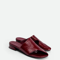 Melanie Dark Red Crinkled Patent Leather Mules - Angled Side View - POEVE Collection