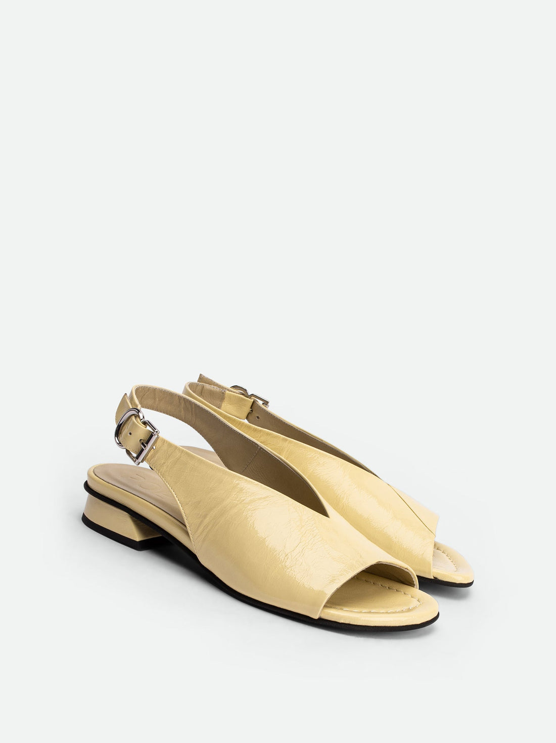 Christin Cream Crinkled Patent Leather Slingbacks - Angled Side View - POEVE Collection