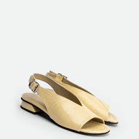 Christin Cream Crinkled Patent Leather Slingbacks - Angled Side View - POEVE Collection