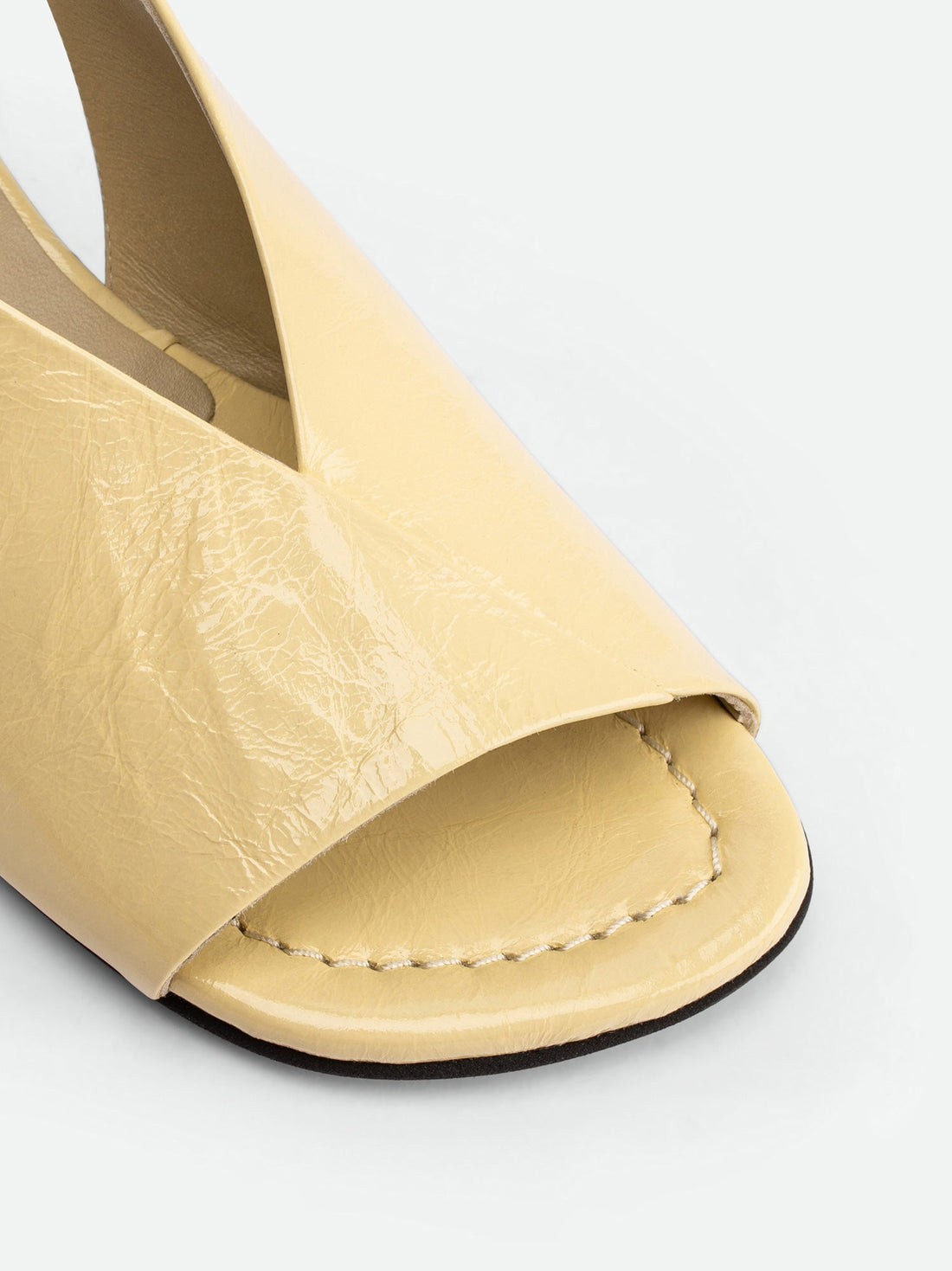 Christin Cream Crinkled Patent Leather Slingbacks - Toe Close-up View - POEVE Collection