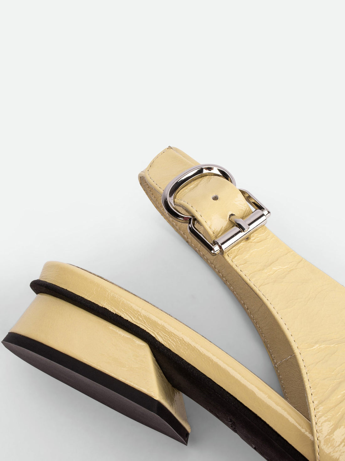 Christin Cream Crinkled Patent Leather Slingbacks - Heel Close-up View - POEVE Collection