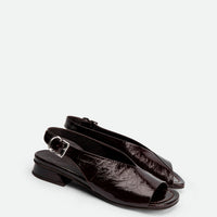 Christin Brown Crinkled Patent Leather Slingback Sandals - Angled Side View - POEVE Collection