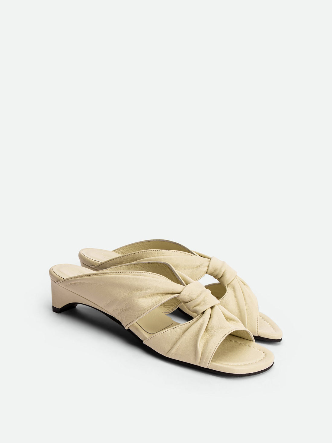Adele Beige Leather Heel Mules - Angled Side View - POEVE Collection