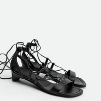 Muse Black Leather Heel Lace-up Sandals - Angled Side View - POEVE Collection