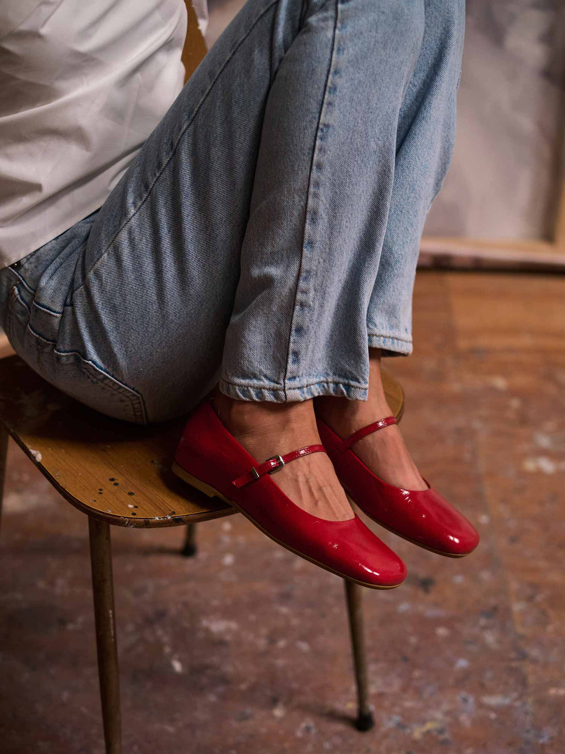 Eloise Red Crinkled Patent Leather Ballerinas, styled with cuffed denim - POEVE Collection
