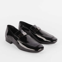 Valentina Black Patent Leather Loafers with Metal Accessory - Angled Side View - POEVE Collection