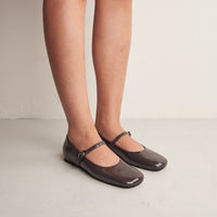 Aurora Grey Patent Leather Ballerinas, worn on bare legs - POEVE Collection