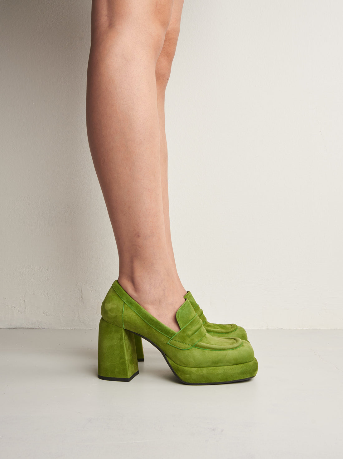 Zery Green Suede Heel Loafers, worn on bare legs - POEVE Collection