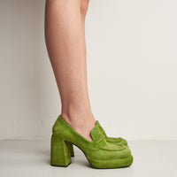 Zery Green Suede Heel Loafers, worn on bare legs - POEVE Collection