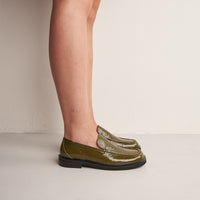 Dannie Green Crinkled Patent Leather Loafers, worn on bare legs - POEVE Collection