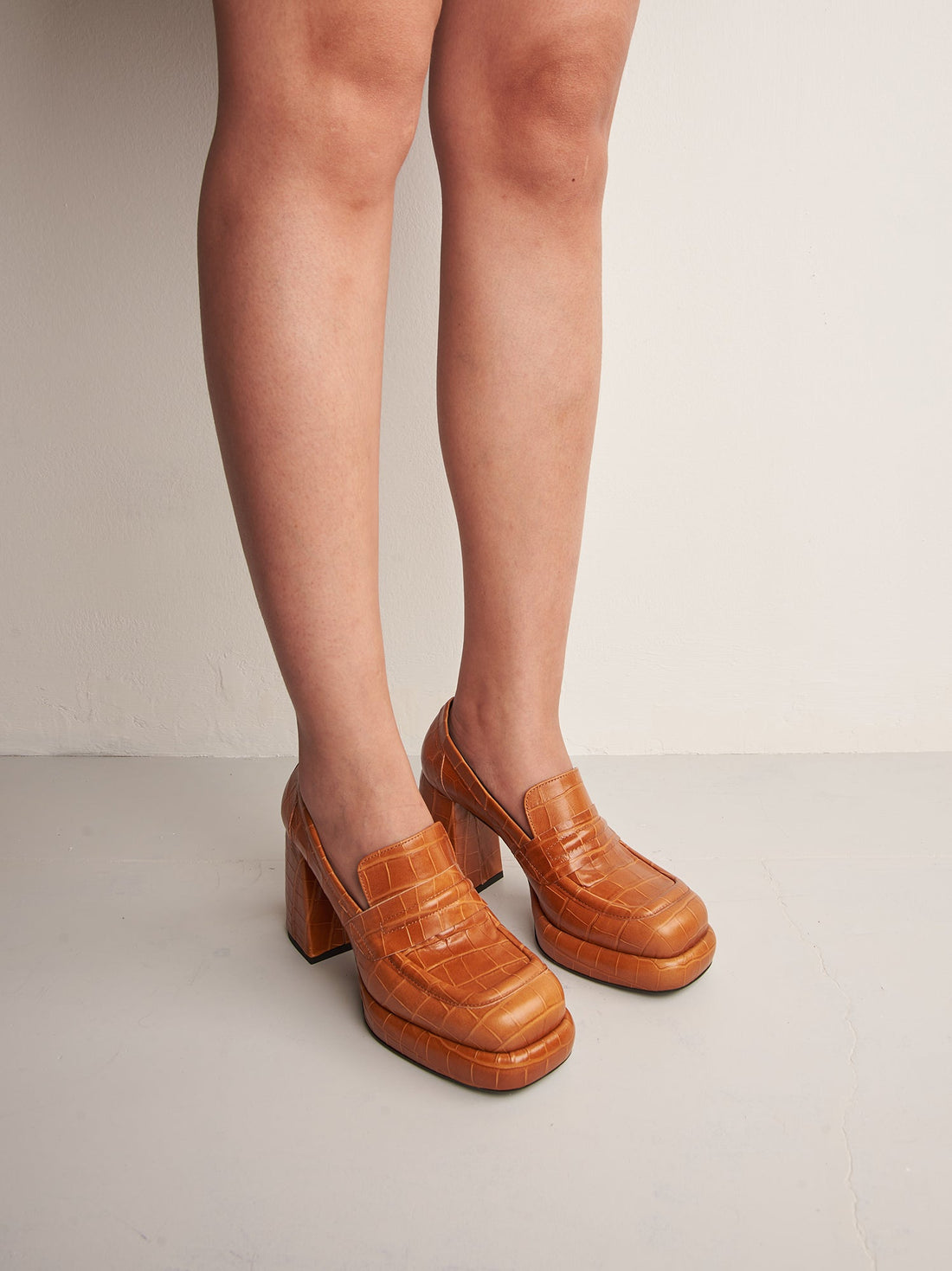 Zery Caramel Croco-print Leather Heel Loafers, worn on bare legs - POEVE Collection