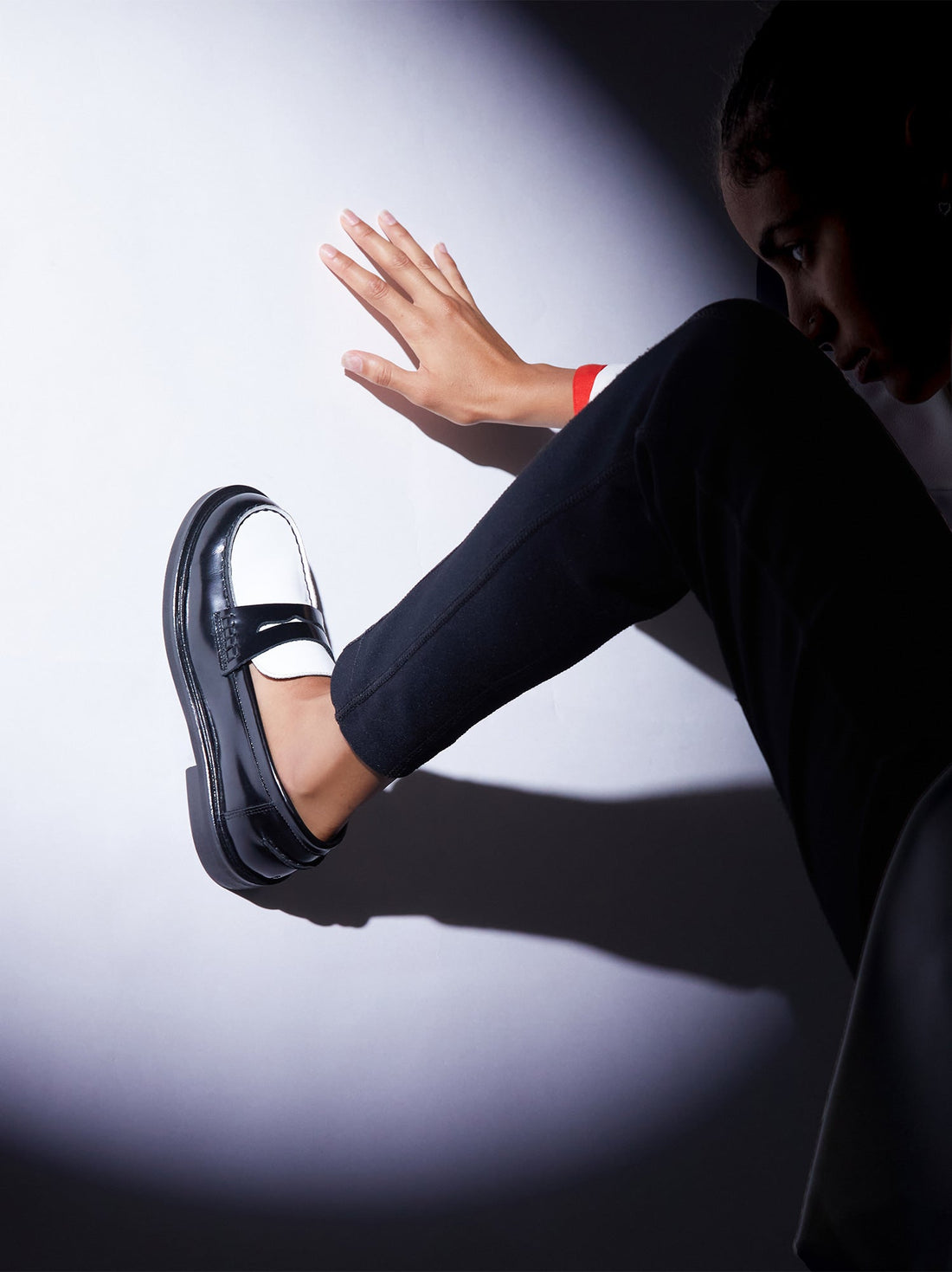 Ollie Black and White Brushed Leather Penny Loafers, styled with black trousers - POEVE Collection