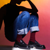 Emil Black Brushed Leather Loafers, styled with burgundy ribbed socks and cuffed denim jeans - POEVE Collection