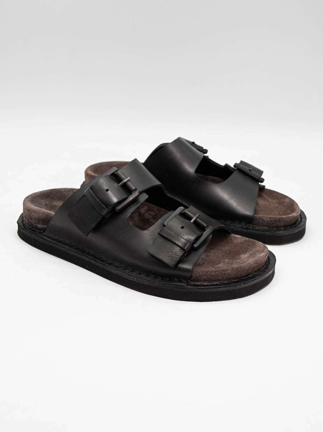 Rory Black Leather Mules with Metal Buckles - Angled Side View - POEVE Collection
