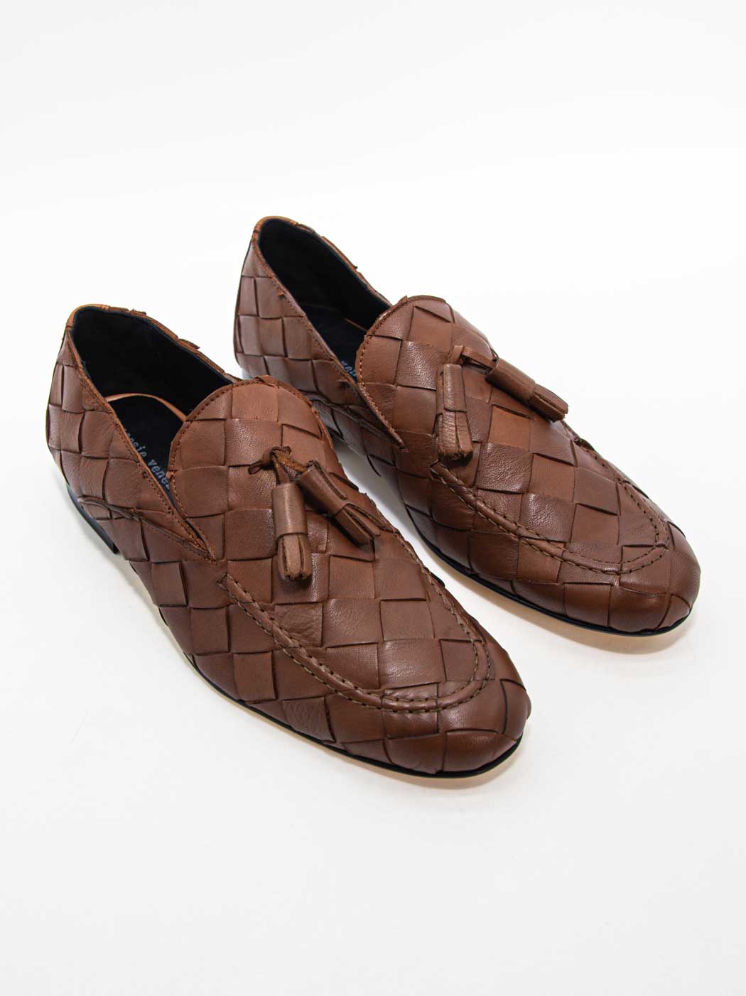 Aidan Cognac Woven Leather Loafers with Leather Tassel - Angled Side View - POEVE Collection