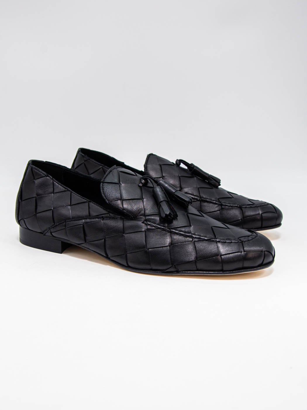 Aidan Black Woven Leather Loafers with Leather Tassel - Three-quarter View - POEVE Collection