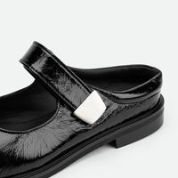 Maris Black Crinkled Patent Leather Mules - Side Close-up View - POEVE Collection