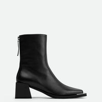 Nora Black Leather Heel Ankle Boots with Metal Detail - Side View - POEVE Collection