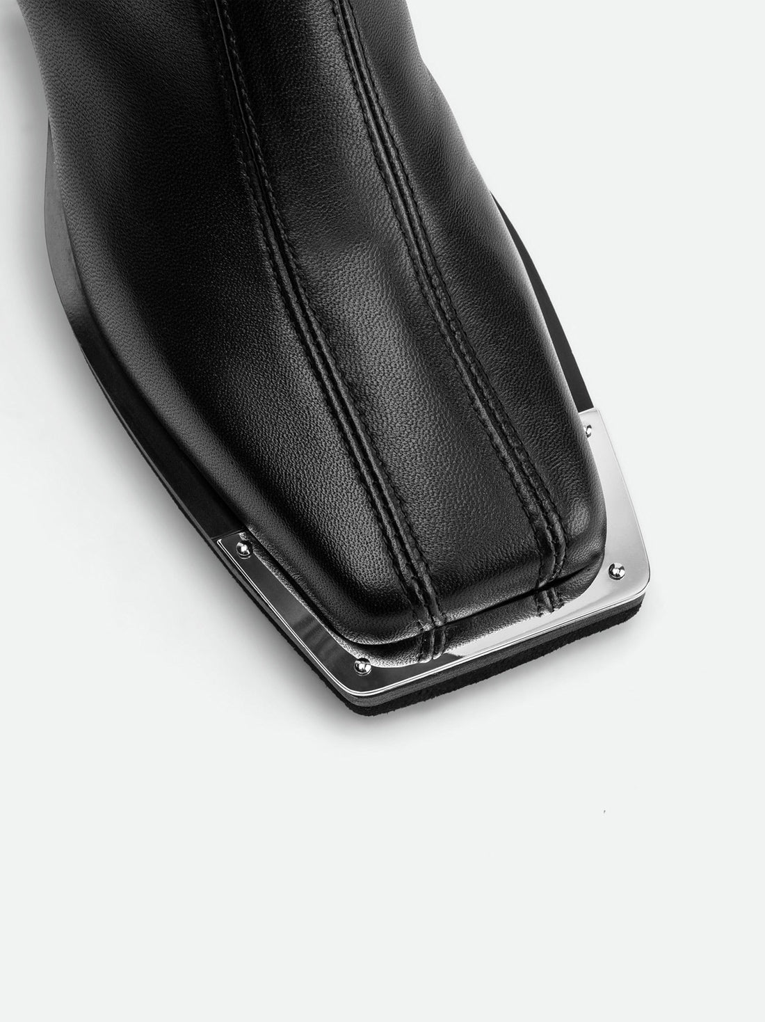 Nora Black Leather Heel Ankle Boots with Metal Detail - Toe Close-up View - POEVE Collection