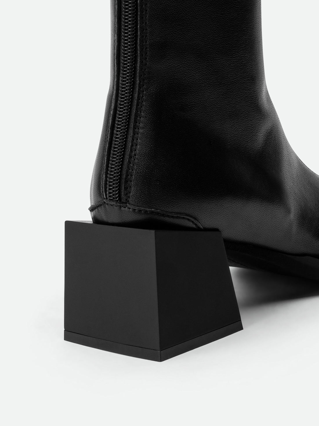 Nora Black Leather Heel Ankle Boots with Metal Detail - Heel Close-up View - POEVE Collection
