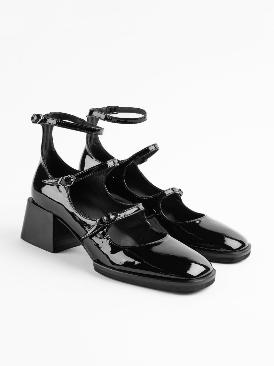 Maven Black Patent Leather Heel Shoes with Metal Buckles - Angled side View - POEVE Collection