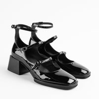 Maven Black Patent Leather Heel Shoes with Metal Buckles - Angled side View - POEVE Collection