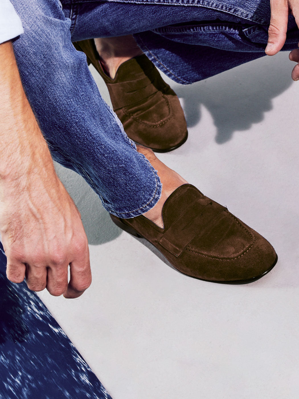 Oscar Brown Crust Leather Penny Loafers, styled with raw-hem denim jeans - POEVE Collection