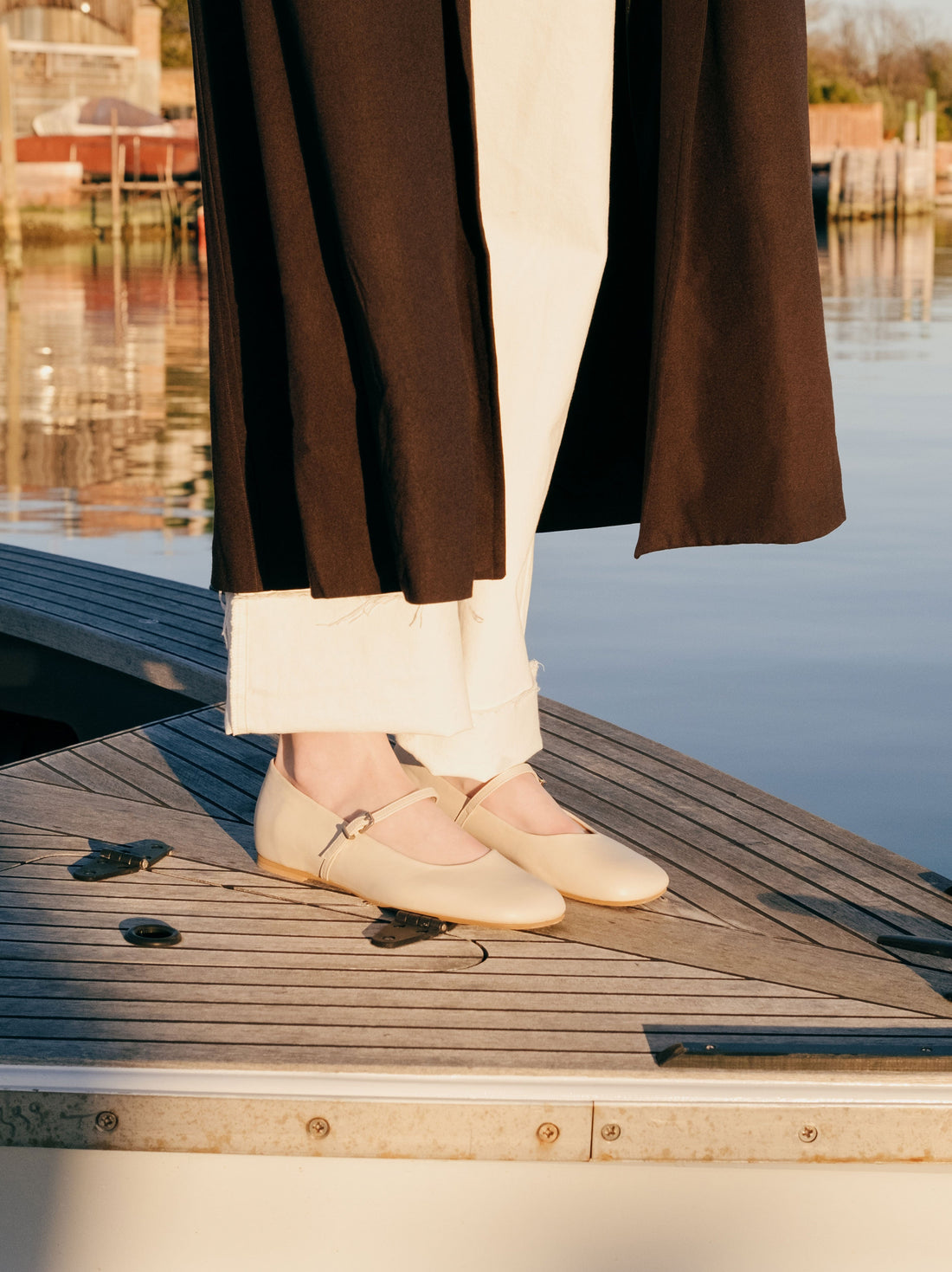 Eloise Beige Leather Ballerinas, styled with wide-leg cream trousers and a dark coat - POEVE Collection