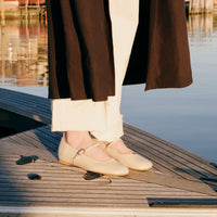 Eloise Beige Leather Ballerinas, styled with wide-leg cream trousers and a dark coat - POEVE Collection