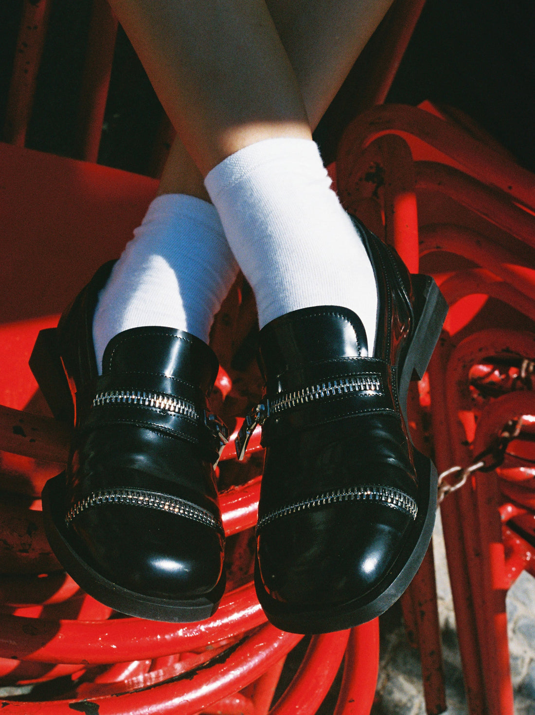 Ayko Black Brushed Leather Loafers with Metal Zipper, worn with white socks - POEVE Collection