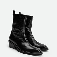 Elow Black Crinkled Glossy Leather Ankle Boots – Angled View – POEVE Collection