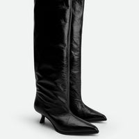 Auree Black Crinkled Glossy Leather Knee-High Boots – Angled View – POEVE Collection